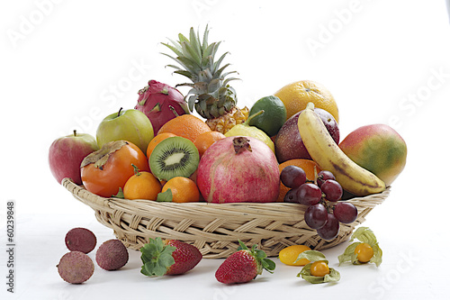 Fototapeta Naklejka Na Ścianę i Meble -  Mix of native and exotic fruits in the basket