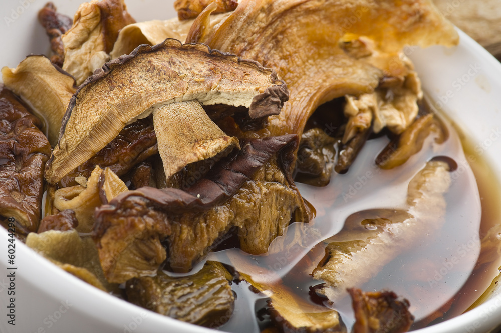 cinnamon sticks and dried porcini mushrooms in jar cinnamon sticks and dried porcini mushrooms in jar