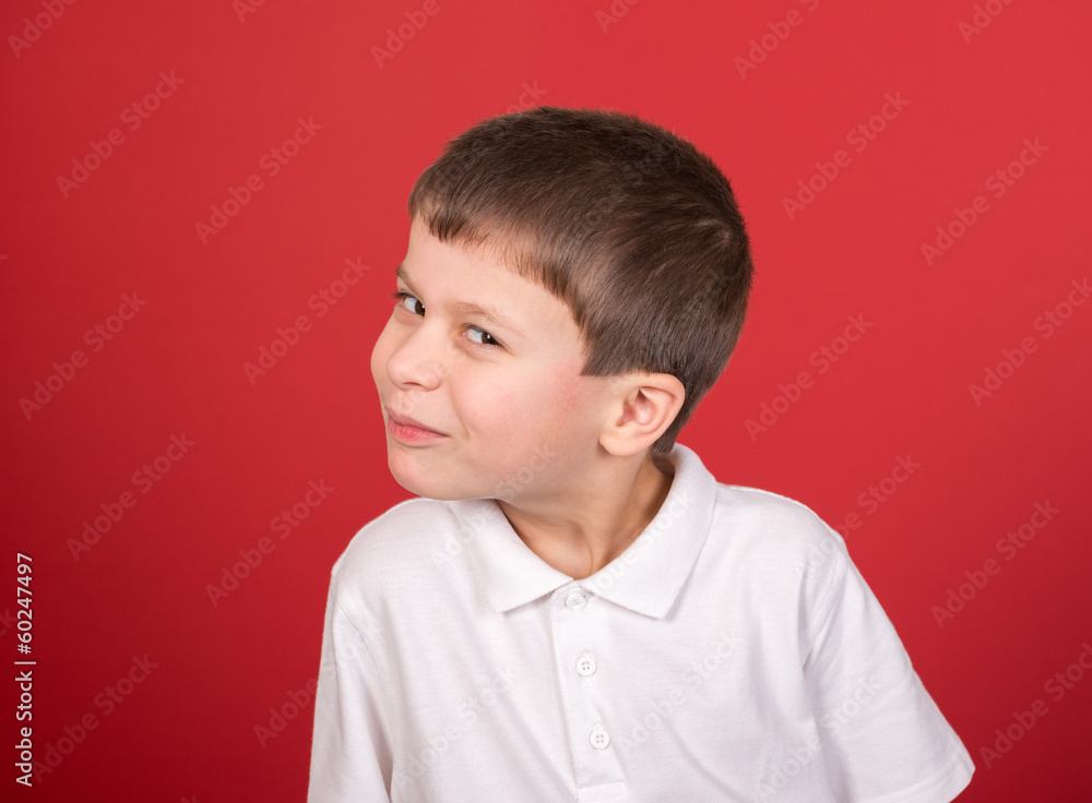 boy portrait in white shirt on red boy portrait in white shirt on red