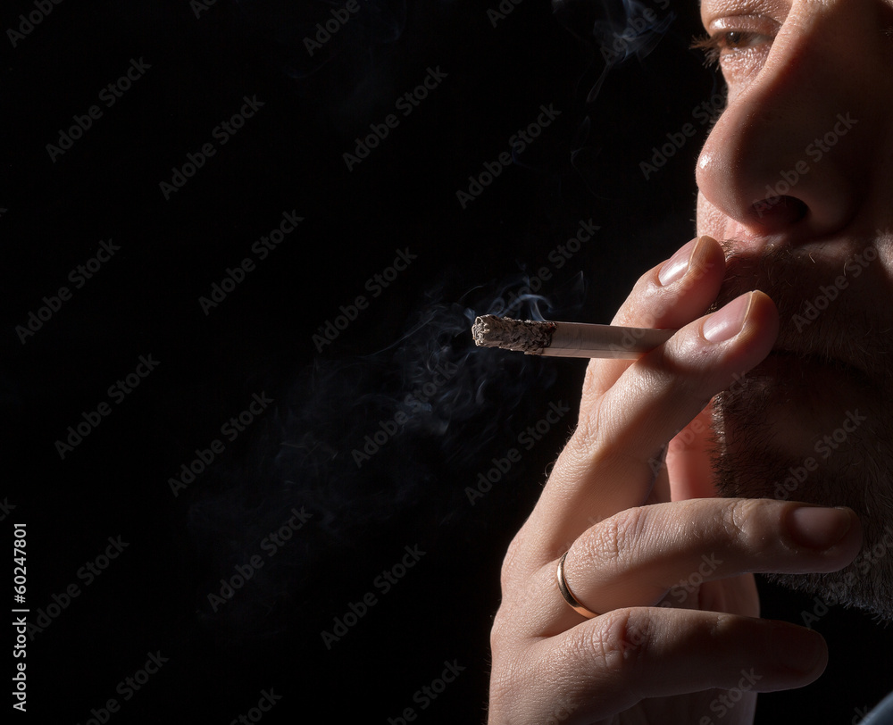 Fototapeta premium Portrait man smoking cigarette