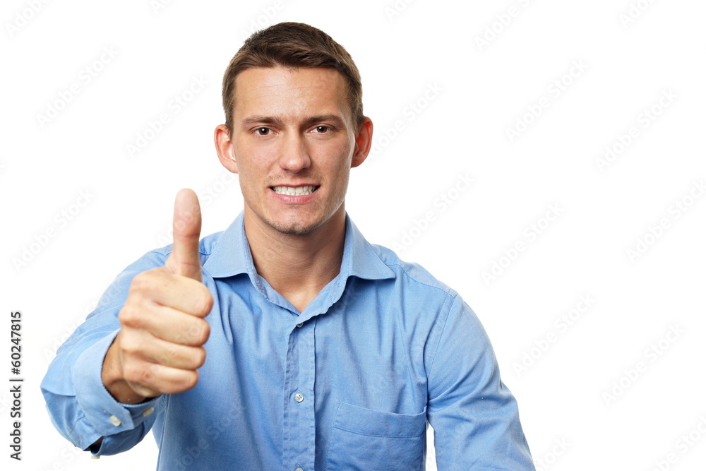 Young businessman showing thumb up, you can write text right Young businessman showing thumb up, you can write text right