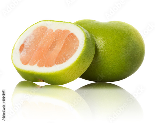 green grapefruit and slices on white background