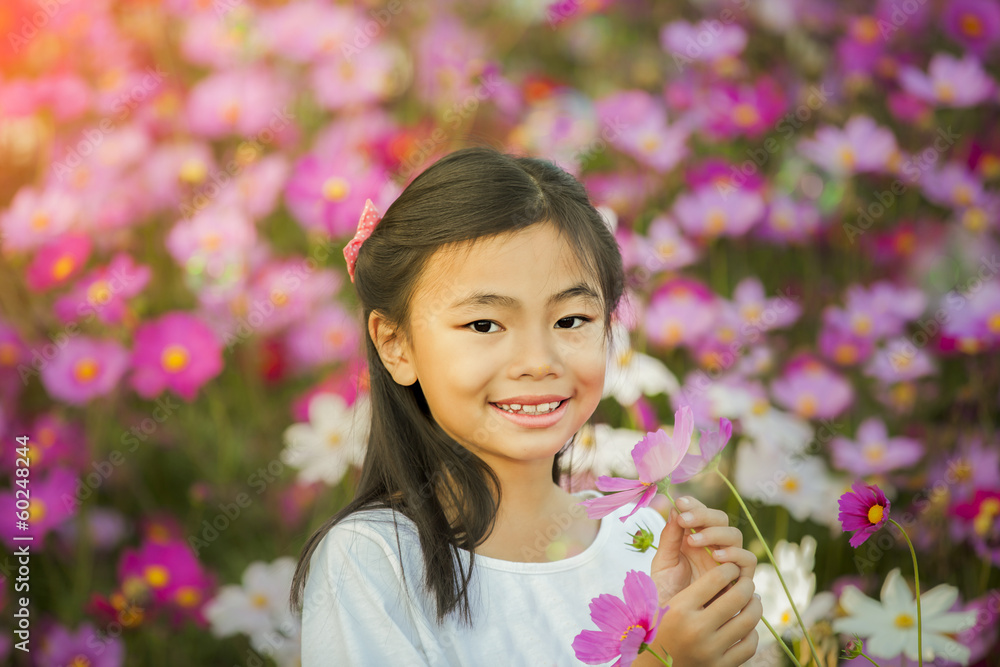 Little asian girl in a garden Little asian girl in a garden