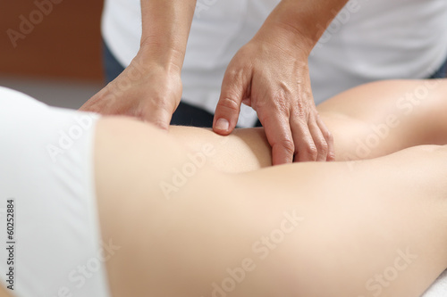 Close up of a woman legs receiving a massage