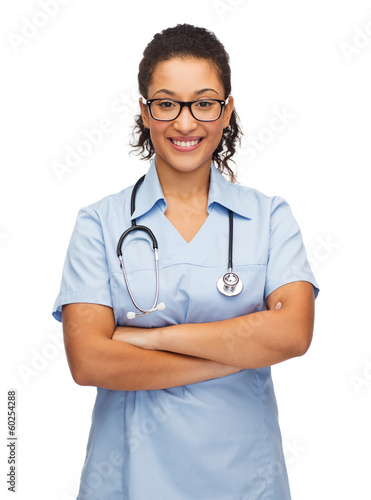 smiling female african american doctor or nurse © Syda Productions