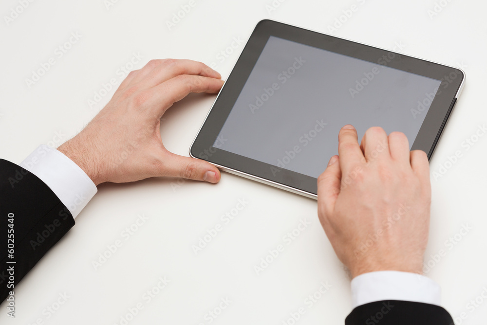 close up of man hands touching tablet pc