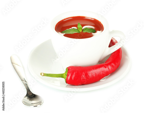 white cup with hot chocolate and chili pepper isolated on white