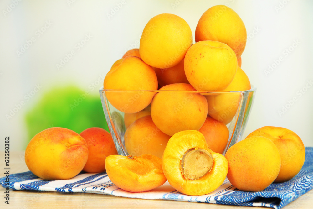 Fresh natural apricot in bowl on table in kitchen Fresh natural apricot in bowl on table in kitchen
