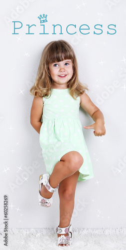 Little cute girl on carpet,...