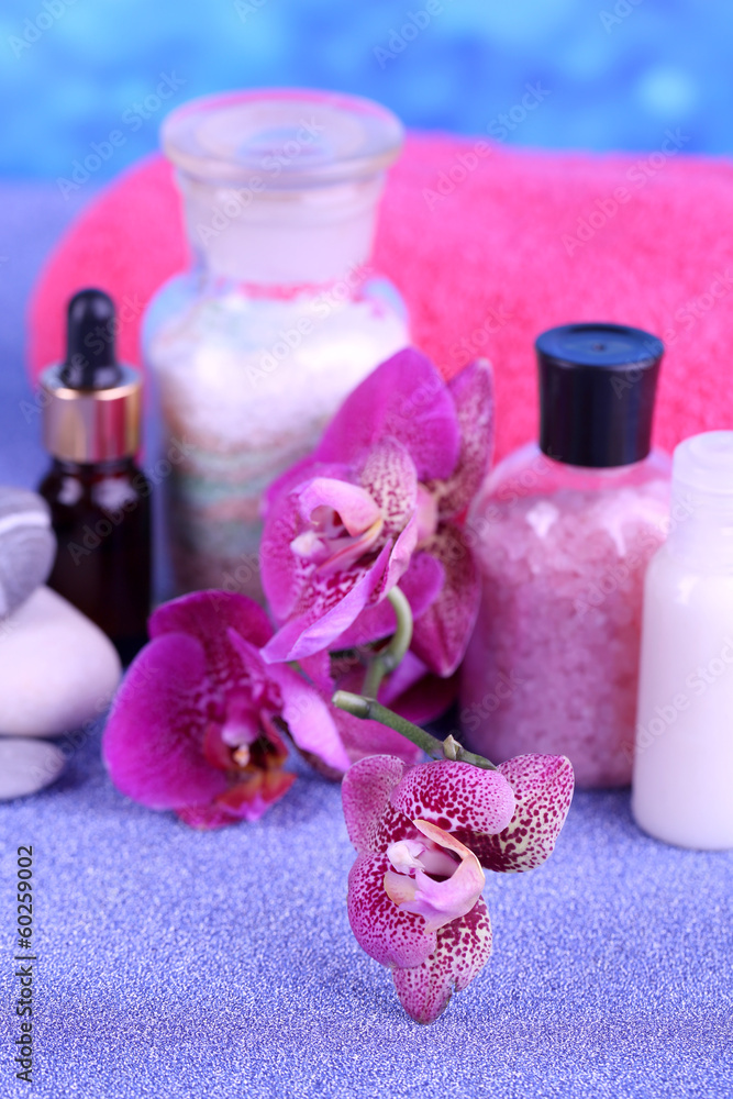 Beautiful spa setting with orchid on blue background Beautiful spa setting with orchid on blue background