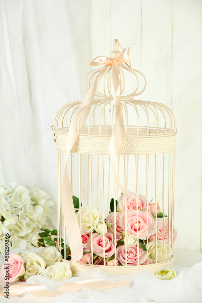 Beautiful decorative cage with beautiful flowers Beautiful decorative cage with beautiful flowers