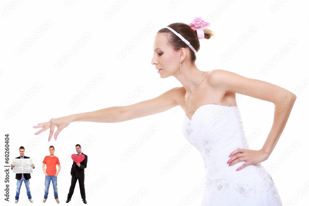 Fototapeta premium Young woman in wedding dress choosing candidate for husband