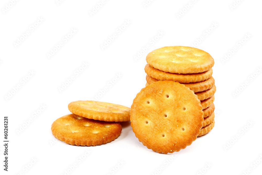 Stack of cracker biscuits on a white background. Stack of cracker biscuits on a white background.