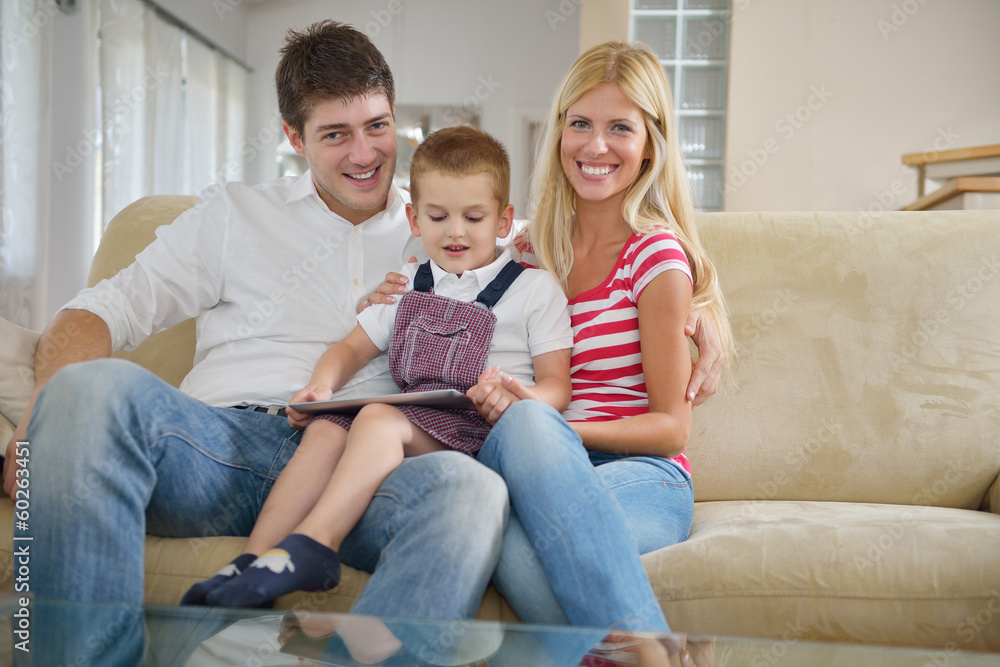 family at home using tablet computer