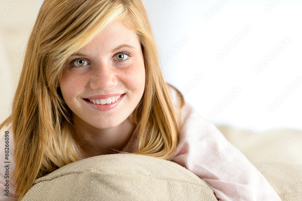 Smiling beautiful teenager girl lying on pillow Smiling beautiful teenager girl lying on pillow