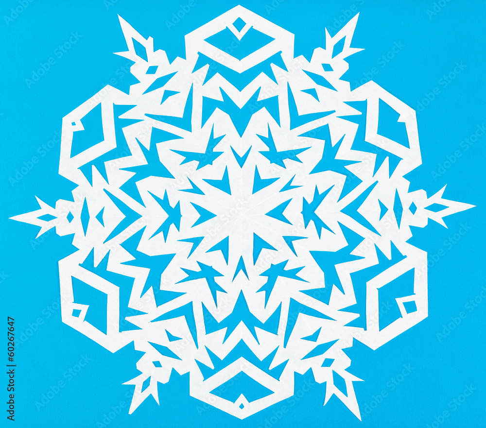 white snowflake on blue paper white snowflake on blue paper
