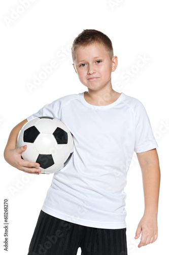 Confident boy with soccer ball © SergiyN