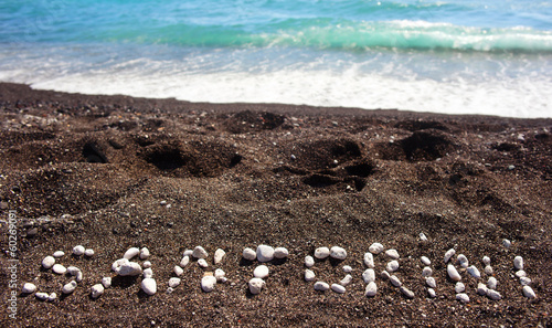 Text Santorini made ​​with pumice stones photo