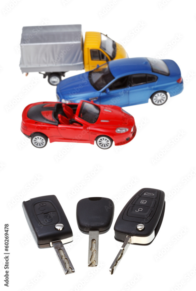 three vehicle keys and model cars