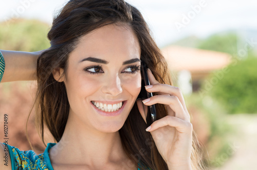 Smiling Woman Talking On Cellphone