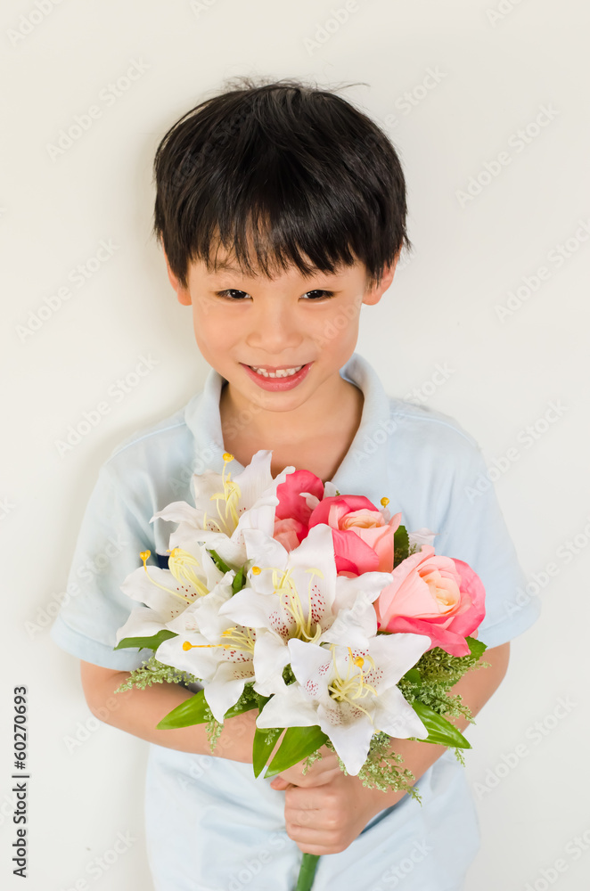 Asian boy holding flower bouquet on white background Asian boy holding flower bouquet on white background