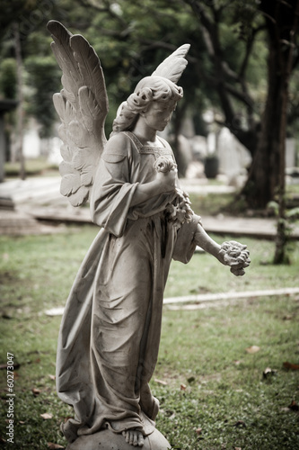 Statue of angel in old cemetery Museum Prasasti