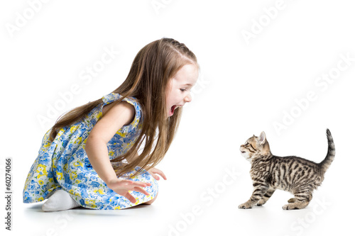 child girl playing with cat...
