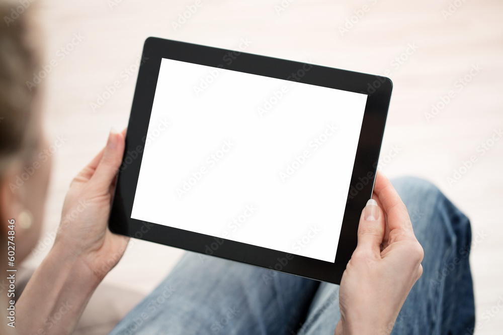 Close up of young woman using digital tablet with copy space