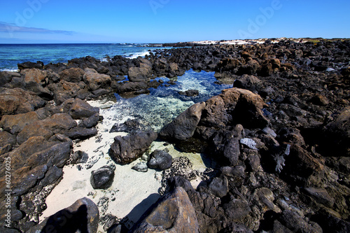 sky light  beach water  in lanzarote  isle foam rock spain lands © lkpro
