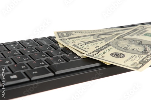 Черная клавиатура с долларами на белом фоне