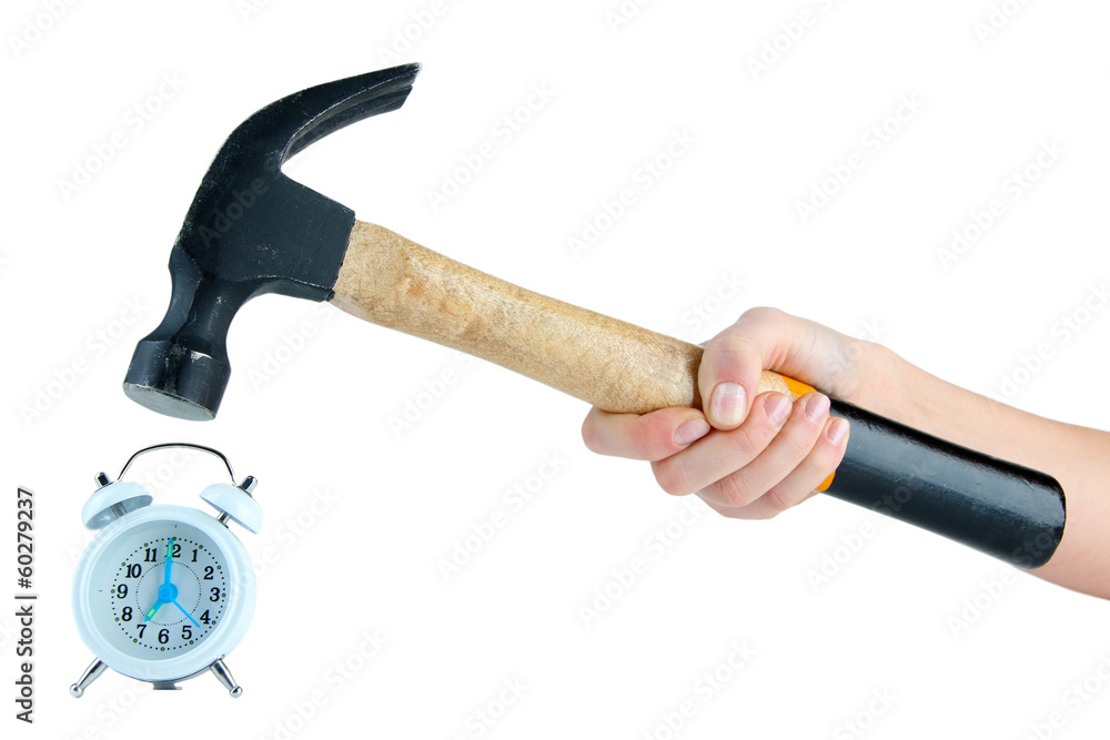 Hammer in hand and alarm clock isolated on white Hammer in hand and alarm clock isolated on white