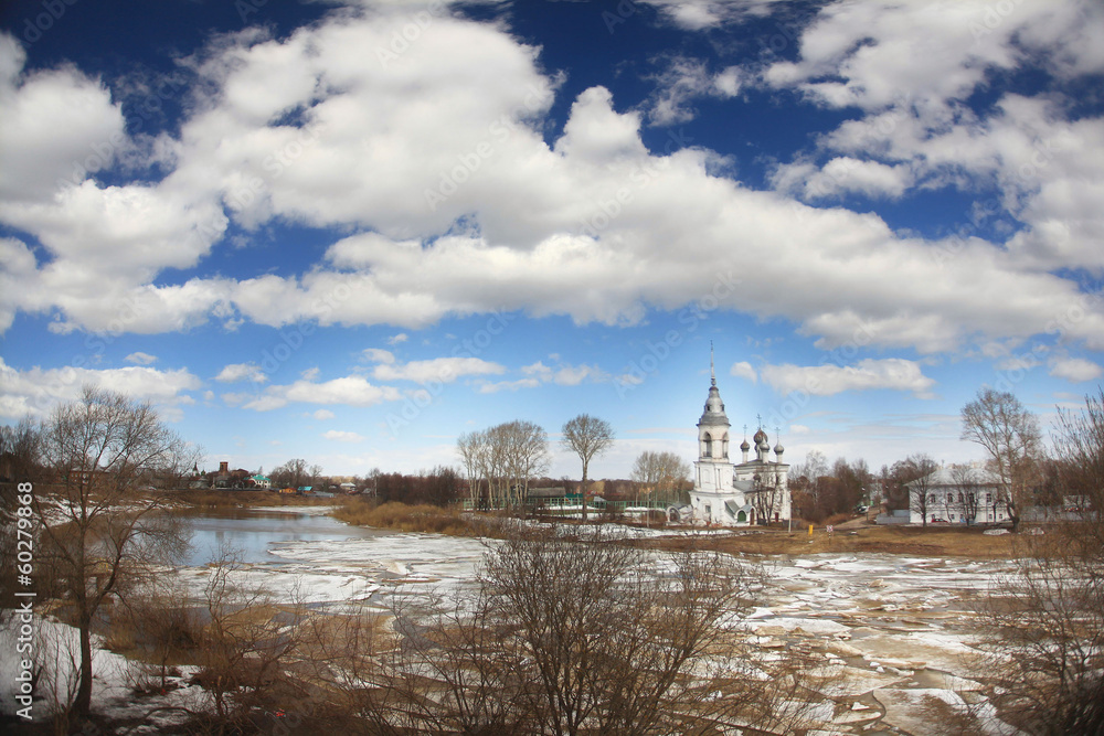 Obraz premium Ice drift on the river in Russia, the church on the shore, the i