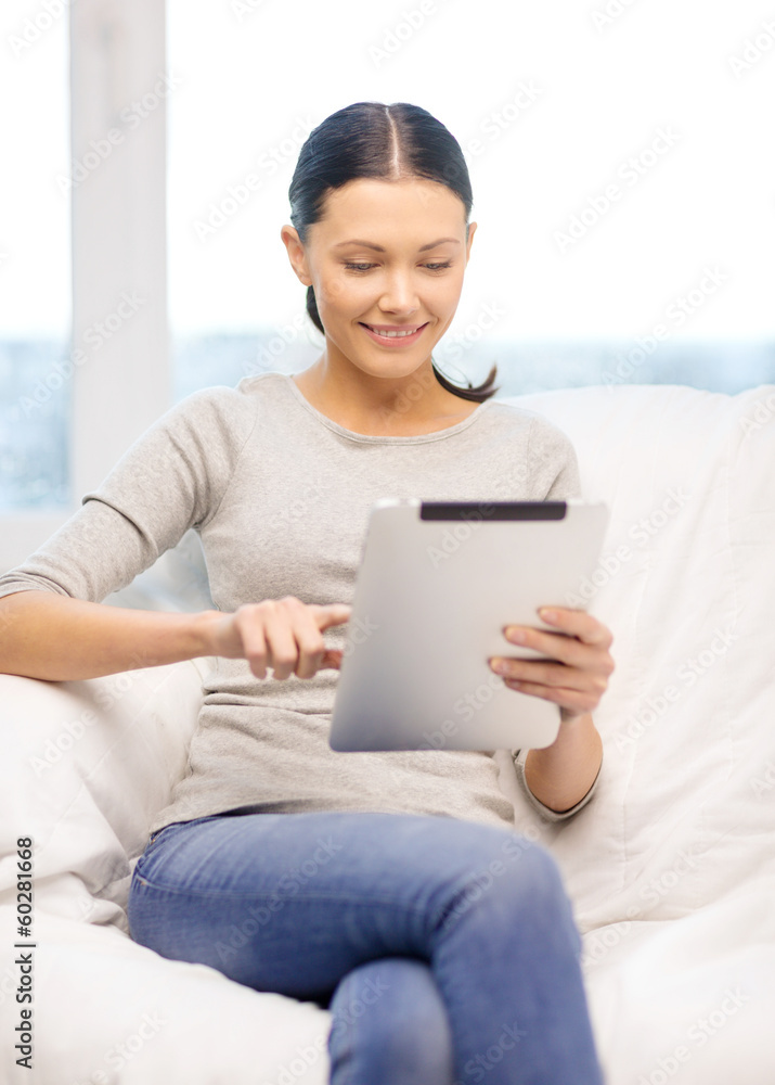 smiling woman with tablet pc computer at home smiling woman with tablet pc computer at home