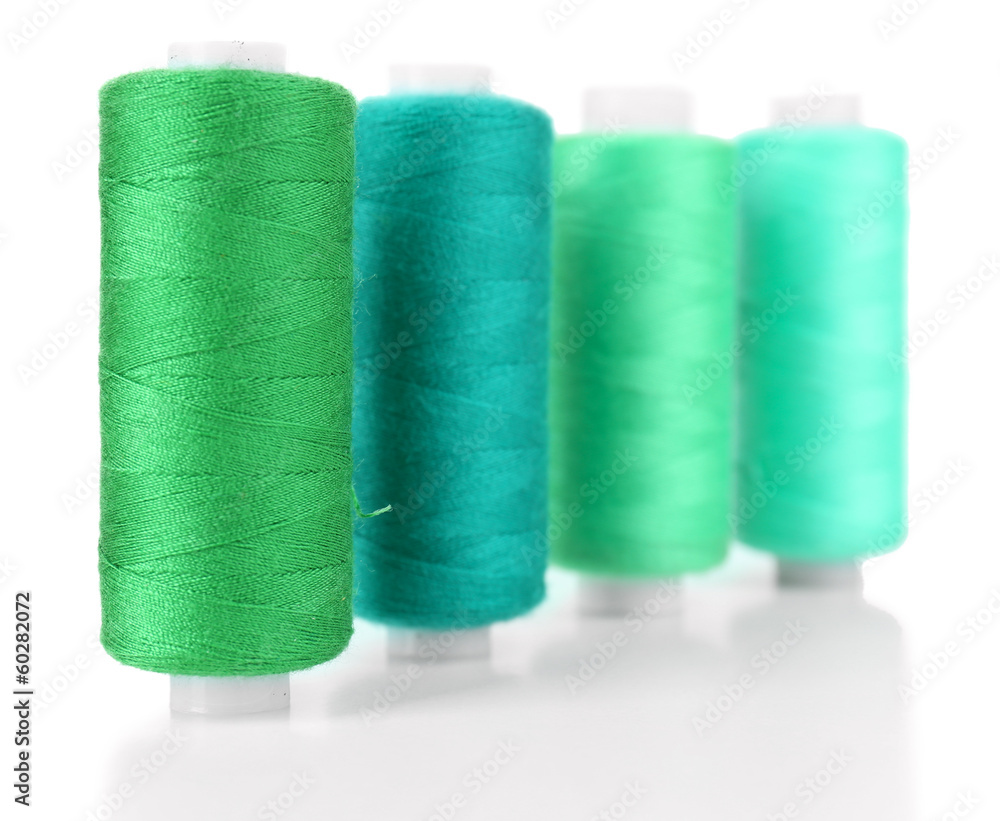 Colored spools of threads isolated on white Colored spools of threads isolated on white