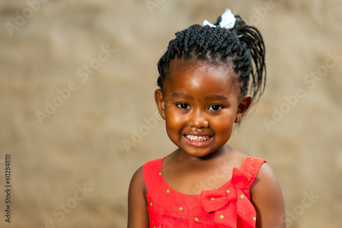 Fotografi Little african girl with braided hairstyle.