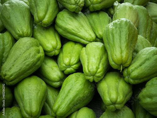 Pile of chayote fruits photo