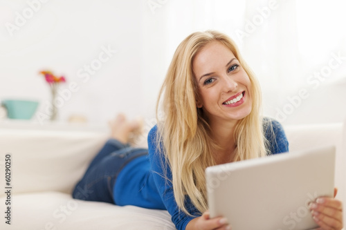 Free Download Beautiful woman with contemporary digital tablet at home - GFXLoad