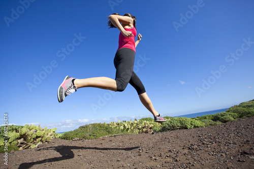 athlete woman running in nature. Healthy active lifestyle young