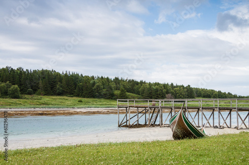 Murais de parede A quay and a boat in Northern Norway during lowtide