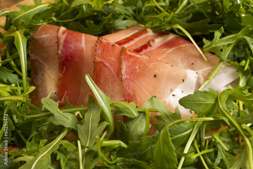 european ham called speck with green salad
