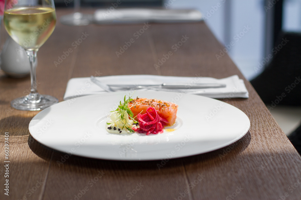 Image of tasty salmon on dish with white vine Image of tasty salmon on dish with white vine