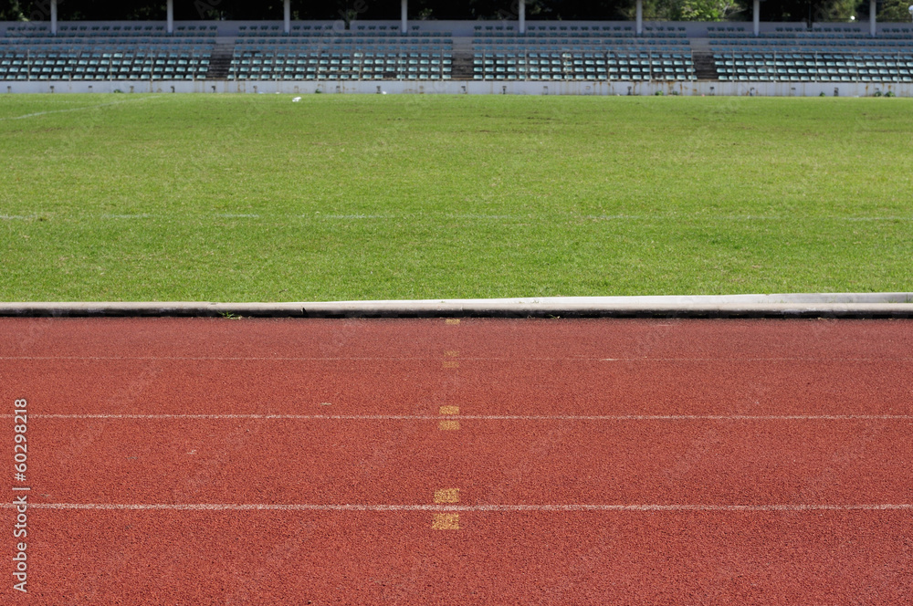 Obraz premium Orange racecourse and green yard.