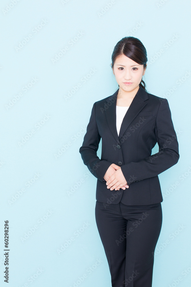 young asian businesswoman on blue background young asian businesswoman on blue background