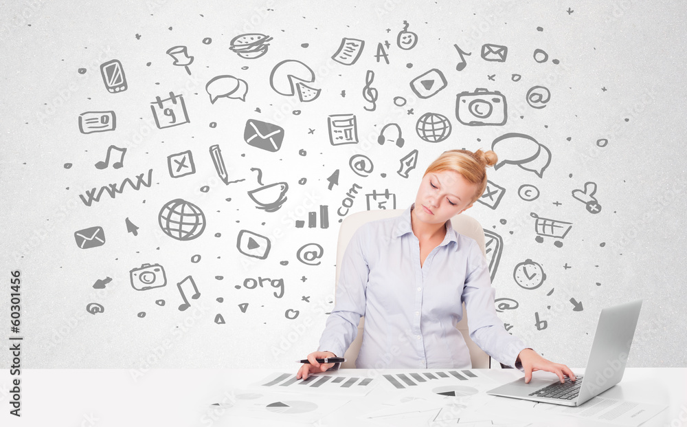 Young businesswoman with all kind of hand-drawn media icons in b Young businesswoman with all kind of hand-drawn media icons in b