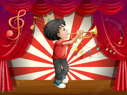 A stage with a male musician