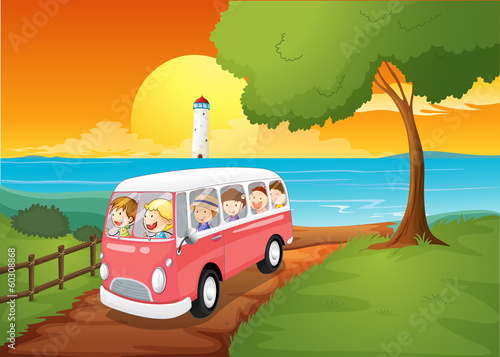 A pink schoolbus travelling