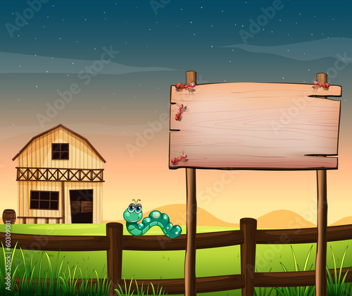 An empty wooden board across the barnhouse at the hilltop