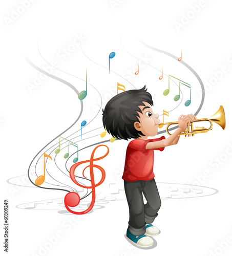A talented young boy playing with the trumpet