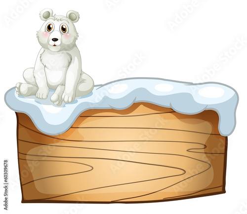 A polar bear above an empty wooden board
