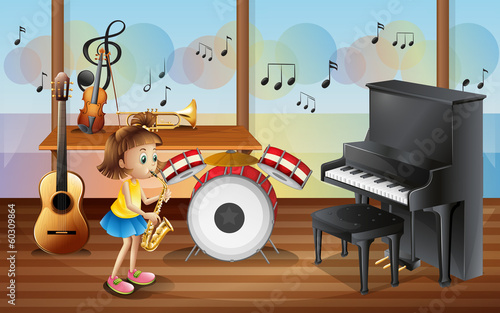 A young girl surrounded with musical instruments